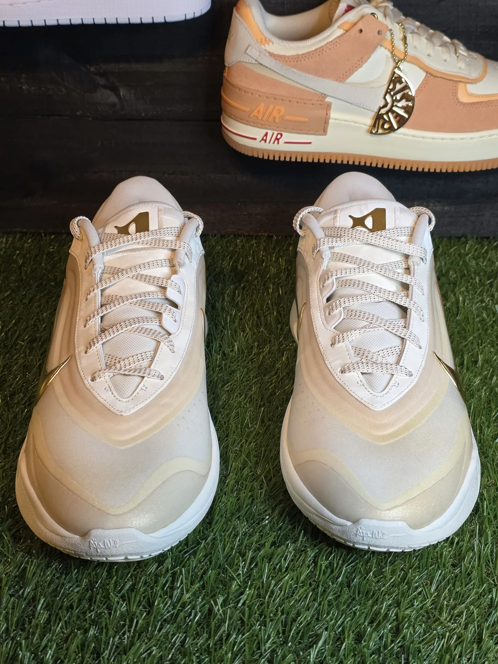Nike Women's White Sneakers with Gold Swoosh